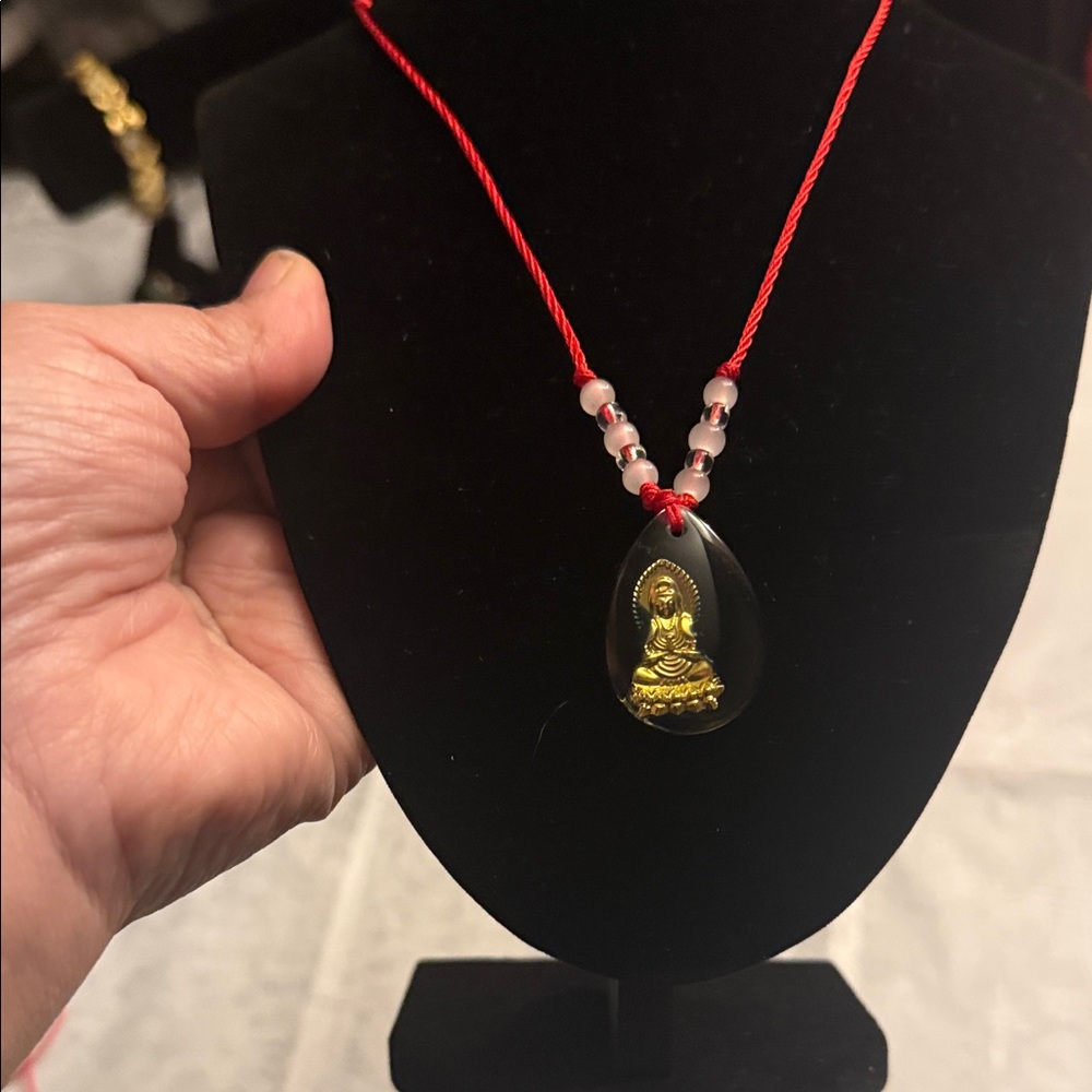 Plated gold color black Buddha Pendant Necklace with adjustable Red Cord